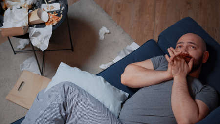 Fatigued, sad, depressed, traumatized adult manの写真素材