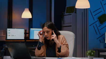 Entrepreneur stressed woman analysing marketing strategy on laptop talking with company manager...