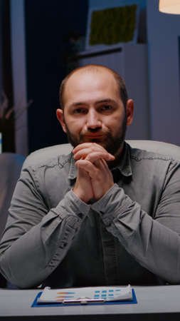 Pov of exhausted businessman discussing with remotely colleague working at financial digital project...