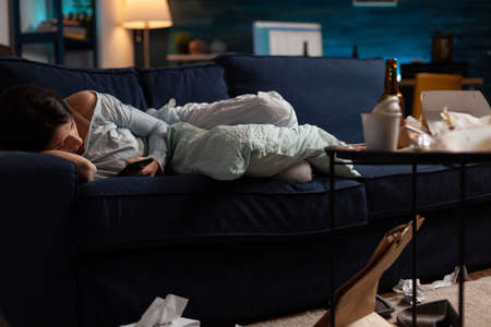 Annoyed, depressed, frustrated, loneliness woman looking at notification for unpaid invoice document received on smartphone. Disappointed, anxious, desperate female reading virtual bank billsの写真素材