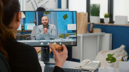 Businesswoman discussing with remote entrepreneur during online videocall meeting conference having...