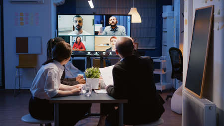 Multi ethnic businesspeople brainstorming company ideas during online videocall conference meeting...