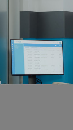 Close up of empty desk for nurses with computer monitor and document files at medical clinic. Nobody in doctors office with healthcare instruments and professional equipment for checkupの写真素材