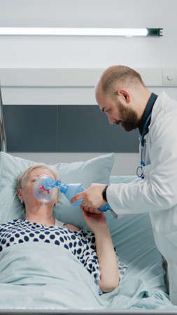 Sick woman hyperventilating and asking about medical assistance while doctor and nurse rushing to...