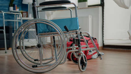 Nobody in nursing home room with transportation support for patients. Empty space with wheelchair...