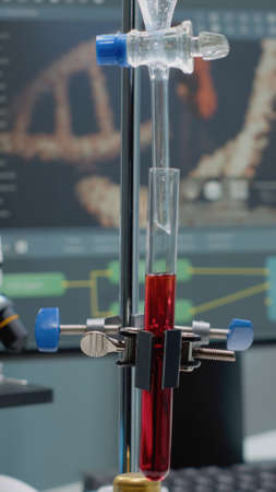 Close up of test tube and pipe for mixing solutions in laboratory on desk. Medical research...