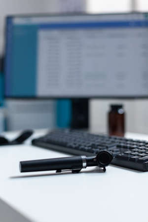 Selective focus on otoscopy medical tool standing on table in hospital professional cabient office....