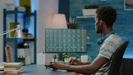 Person working with stock market finance on computer. Broker looking at data charts with crypto...