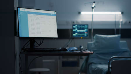 Hospital ward with empty bed and modern equipment at medical facility unit. Nobody in emergency room...
