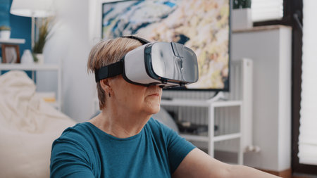 Close up of pensioner meditating with vr glasses at home. Retired woman doing yoga and meditation,...