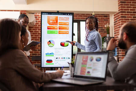 Businessteam analyzing marketing graph on monitor working at company strategy during business...