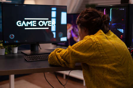 Angry streamer losing space shooter videogames during online entertainment competition at home in...