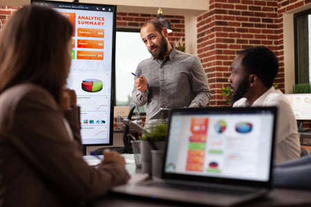 Businesswoman discussing management presentation brainstorming ideas for company project sitting at...