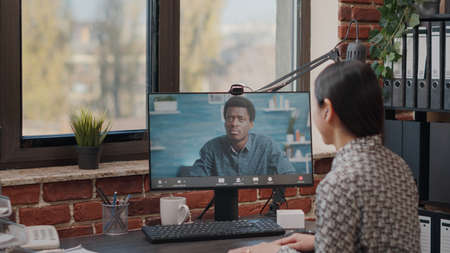 Handheld shot of woman talking to man on video call communication. Person using online remote...