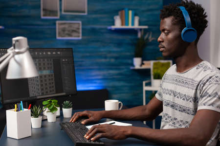 Architect engineer working remote from home at building prototype on computer analyzing...