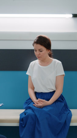 African american medic consulting patient in doctors office with medical equipment, tools, computer and desk for healthcare consultation. Woman and doctor at annual checkup visit.の写真素材