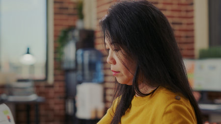 Company accountant planning business development and sales growth in startup ofice. Employee working on financial strategy for big investment, creating successful presentation. Close upの写真素材