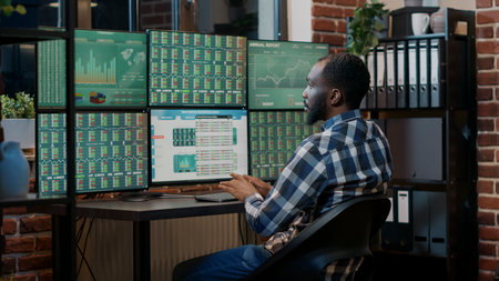 Male broker using forex trade exchange statistics on multiple monitors, working with market charts...