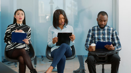 Employment recruits rehearsing speech for job interview with HR department, waiting to start...