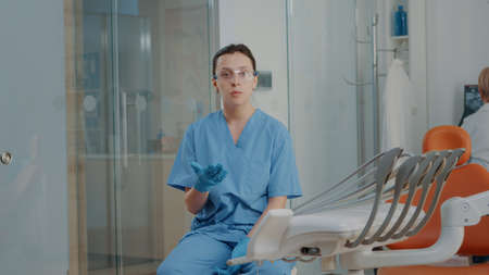 POV of woman nurse meeting on video call with patient, doing oral care consultation in dentistry...