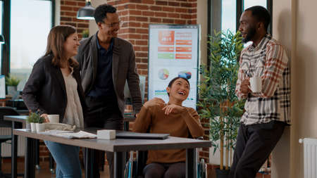 Diverse group of people laughing at doing collaboration to create project strategy for growth....