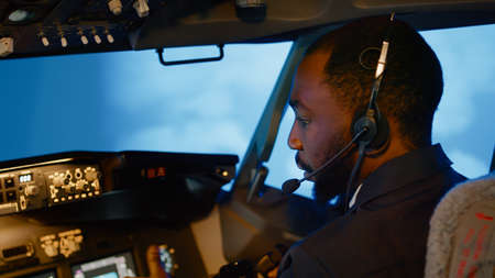 African american copilot using airplane command to fly plane, throttling power engine to takeoff....