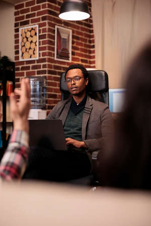 African american counselor listening to partners at couple therapy session, doing psychoanalysis on...
