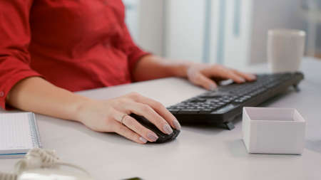 Financial analyst using marketing statistics on computer to plan development strategy with charts...