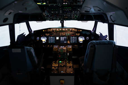 No people in airplane cabin with radar compass windscreen and navigation, control panel command used...