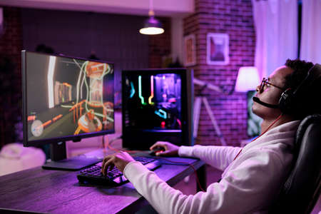 Internet vlogger broadcasting live video games play on computer, having fun with online game...