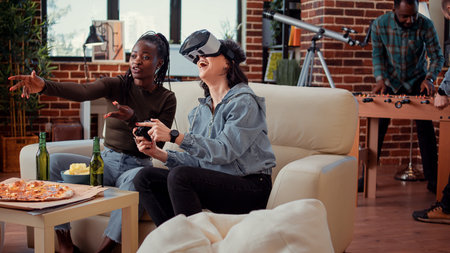 Women playing video games with vr glasses on console, using virtual reality 3d headset to play...