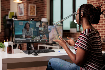 Employee chatting with remote team on video call, telework, freelancing, online brainstorming, teamwork concept. Freelancer working from home, attending videoconference meetingの写真素材