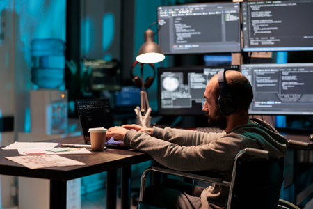 Software developer with chronic disability writing code, computing big data to create app interface. Using html script and database source to program artificial intelligence algorithm.の写真素材