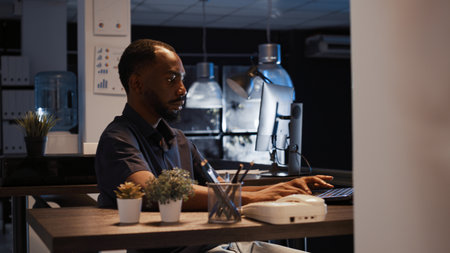 Office worker analyzing startup data on laptop to create project, using research to plan executive...