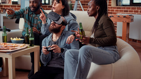 Happy man using vr glasses to play video games on console, having fun with friends at gathering....