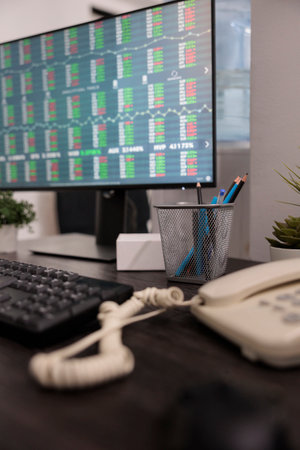 Computer monitor with real time stock market exchange trend, working remotely with global profit investment. Investment desk with money trading statistics, online currency hedge fund.の写真素材
