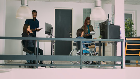 Multiethnic group of programmers collaborating on it project to create algorithm for new cloud...