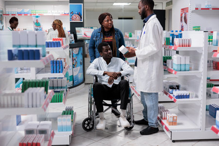 African american man in wheelchair and social worker choosing prescription treatment in drugstore,...