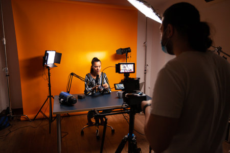 Filming influencer in home for vlog. Content creator new media star on social media recording for...