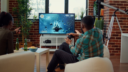 Happy friends winning video games shooting challenge, celebrating online gaming win on television...