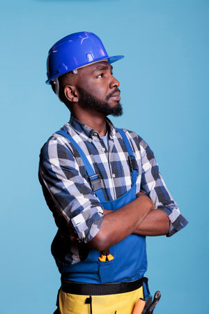 African american builder detailing the work he has just completed on the installation of electrical...