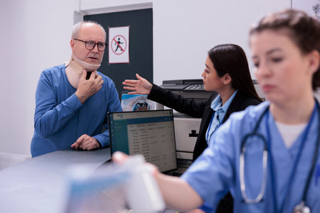 Elderly patient with cervical neck collar being in pain after accident asking employee for help...