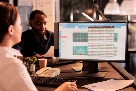 Woman monitoring company investment revenue using fund market software in coworking space, stock...