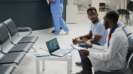 Specialist talking on videocall conference with physician, using online telehealth to chat with...