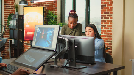 Diverse colleagues brainstorming ideas to create 3d content in creative agency studio, using...