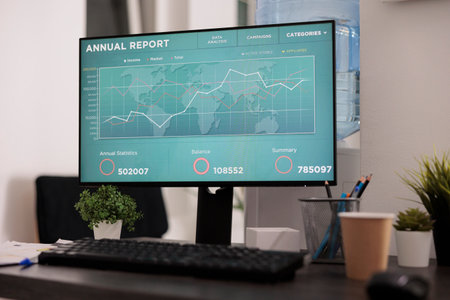 Close up view of computer screen with statistical software showing graphs of annual growth and...