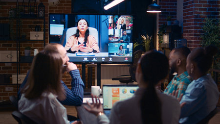 Employees and remote team company revenue statistics discussion in videconference app, diverse...