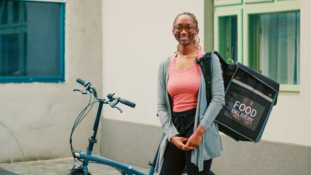 African american delivery employee carrying backpack with food orders, delivering meal package....