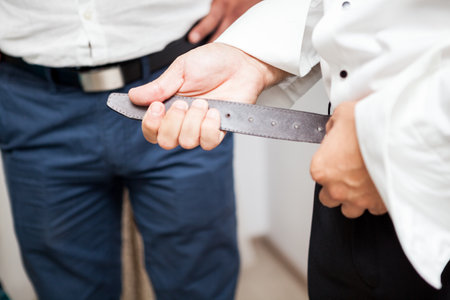 Groom in his weeding day in preparation. Celebration and weddingの写真素材