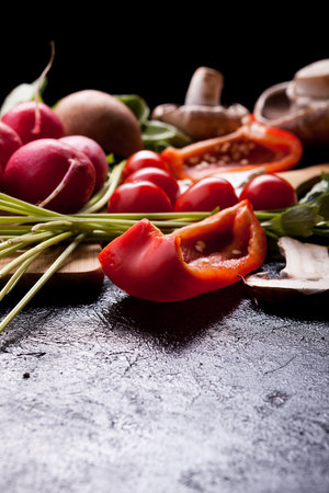 Healthy organic lifestyle concept image with different vegetables on the table. Radish,...